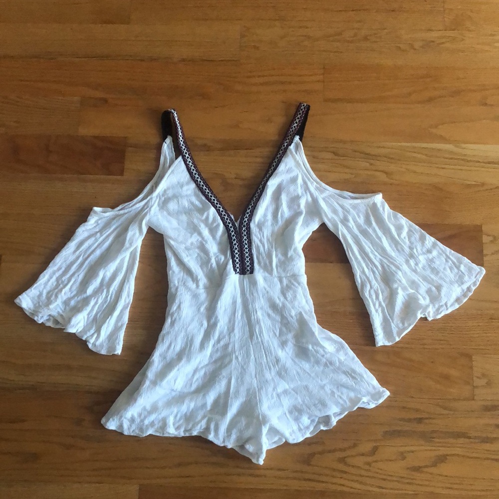 Adorable white romper with peek-a-boo shoulders